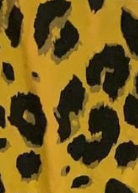 Close up image on leopard print on the mustard dungerees 