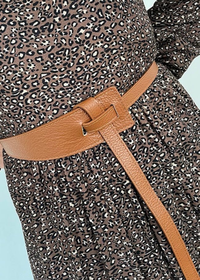 luella tan belt with a tie which is worn to the side