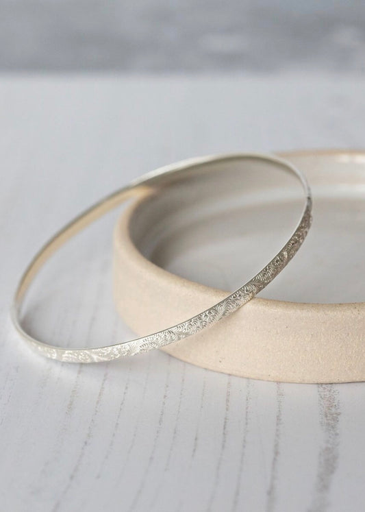Lucy Kemp Sterling Silver bangle with a lace imprint