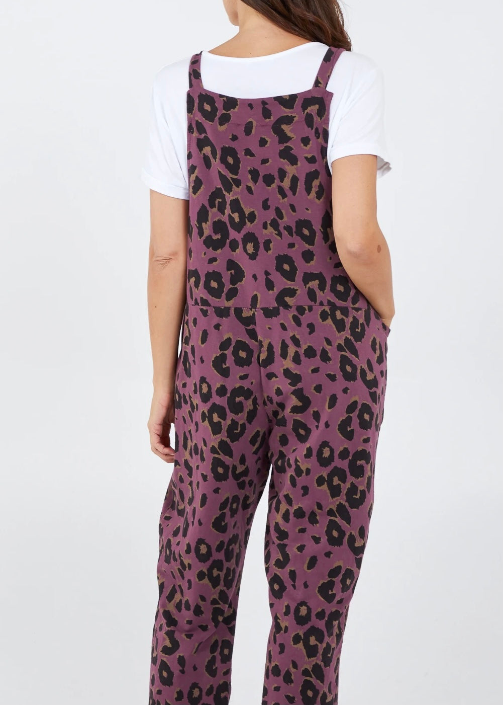 Showing the back of the Porthleven Dungarees in blackcurrent with a leopard print pattern 