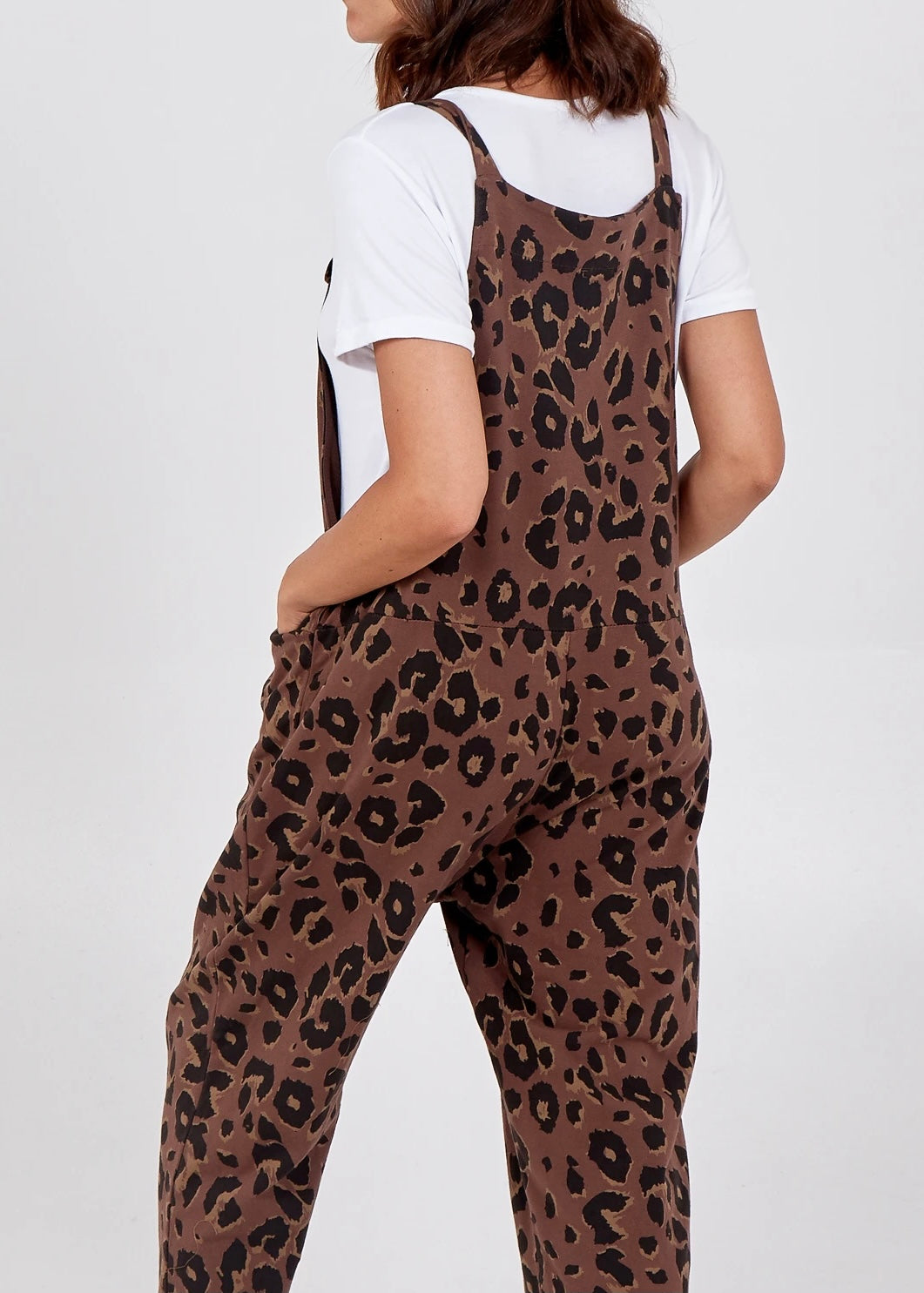 Showing the back of the Porthleven Dungarees in brown with a leopard print pattern 