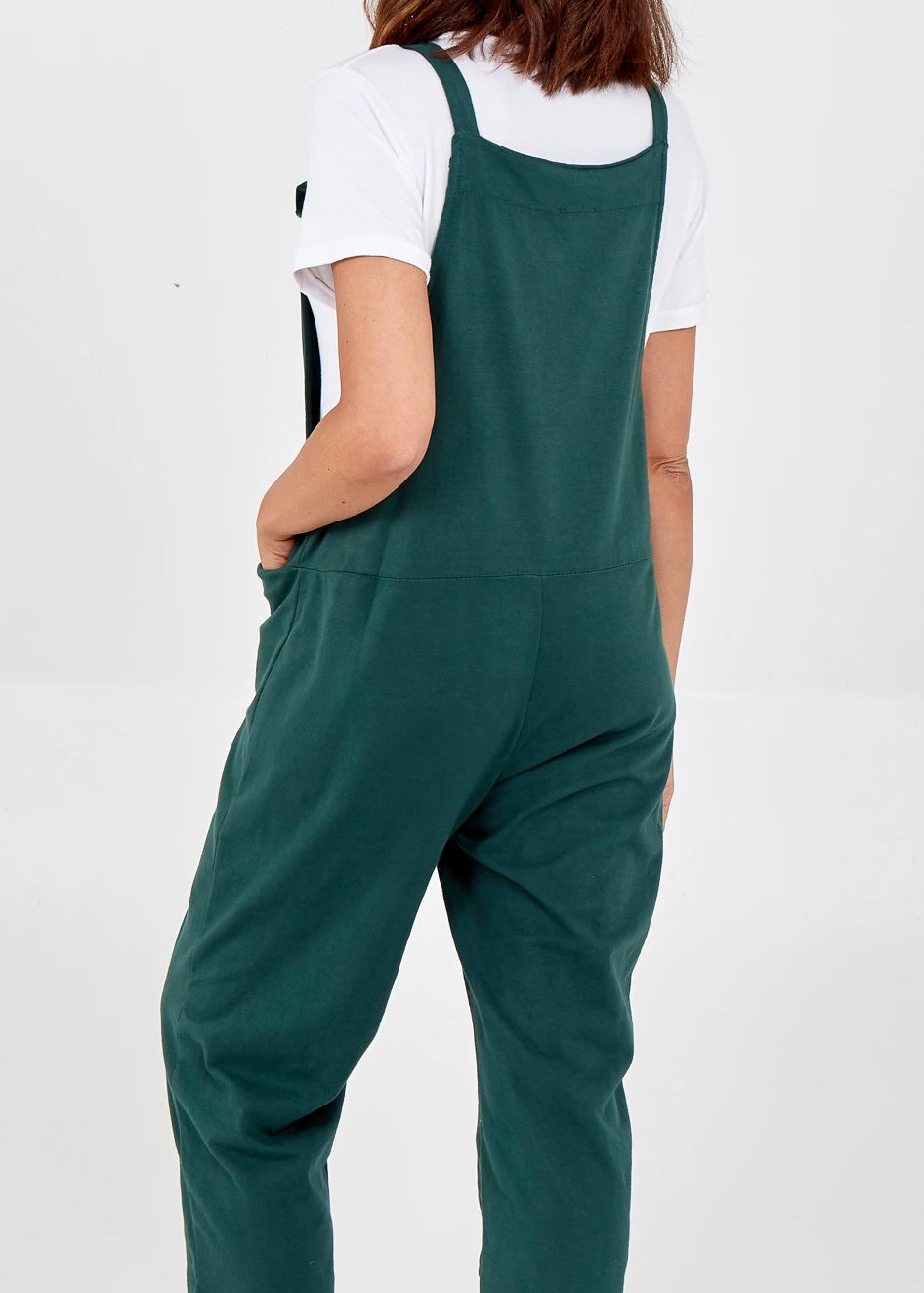 Plain jersey dungarees with tie straps showing the back in green