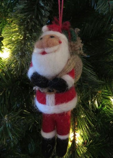 hand felted father christmas hanging on a christmas tree