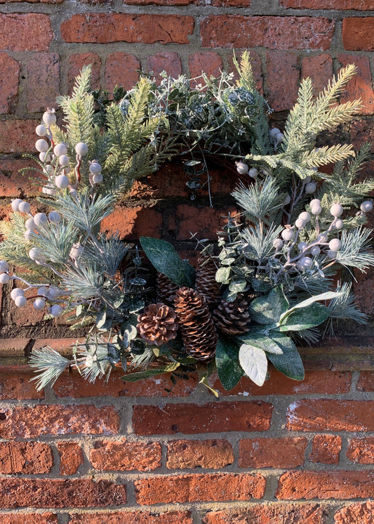Varying leaves and branches with pinecones and berries in green and silver 
