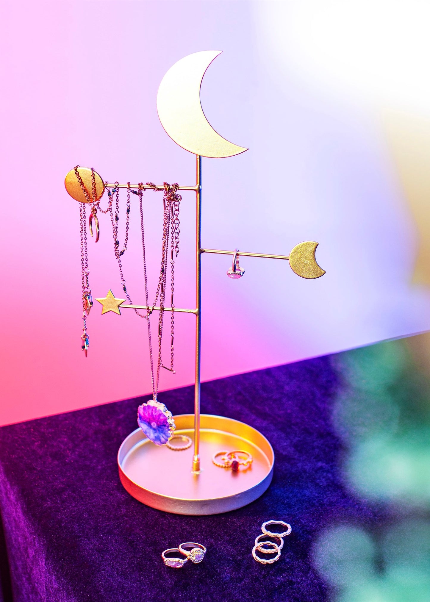 Gold jewlery stand with three arms with moon decorations