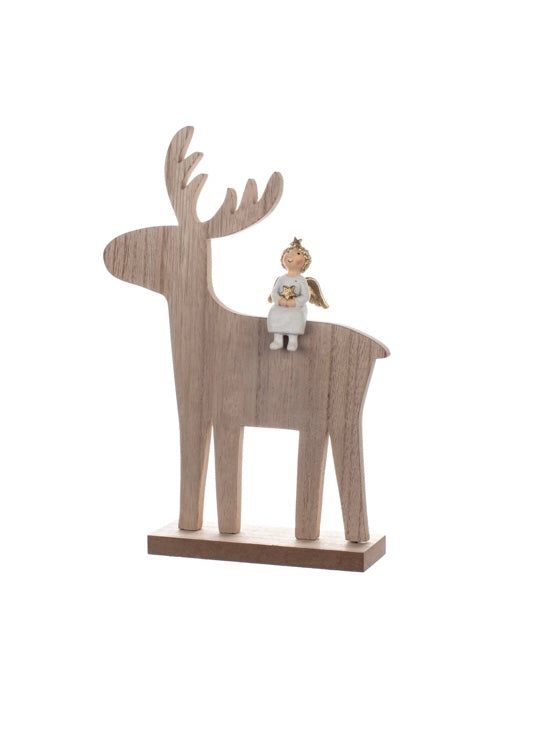 Little angel on the back of large wooden reindeer 