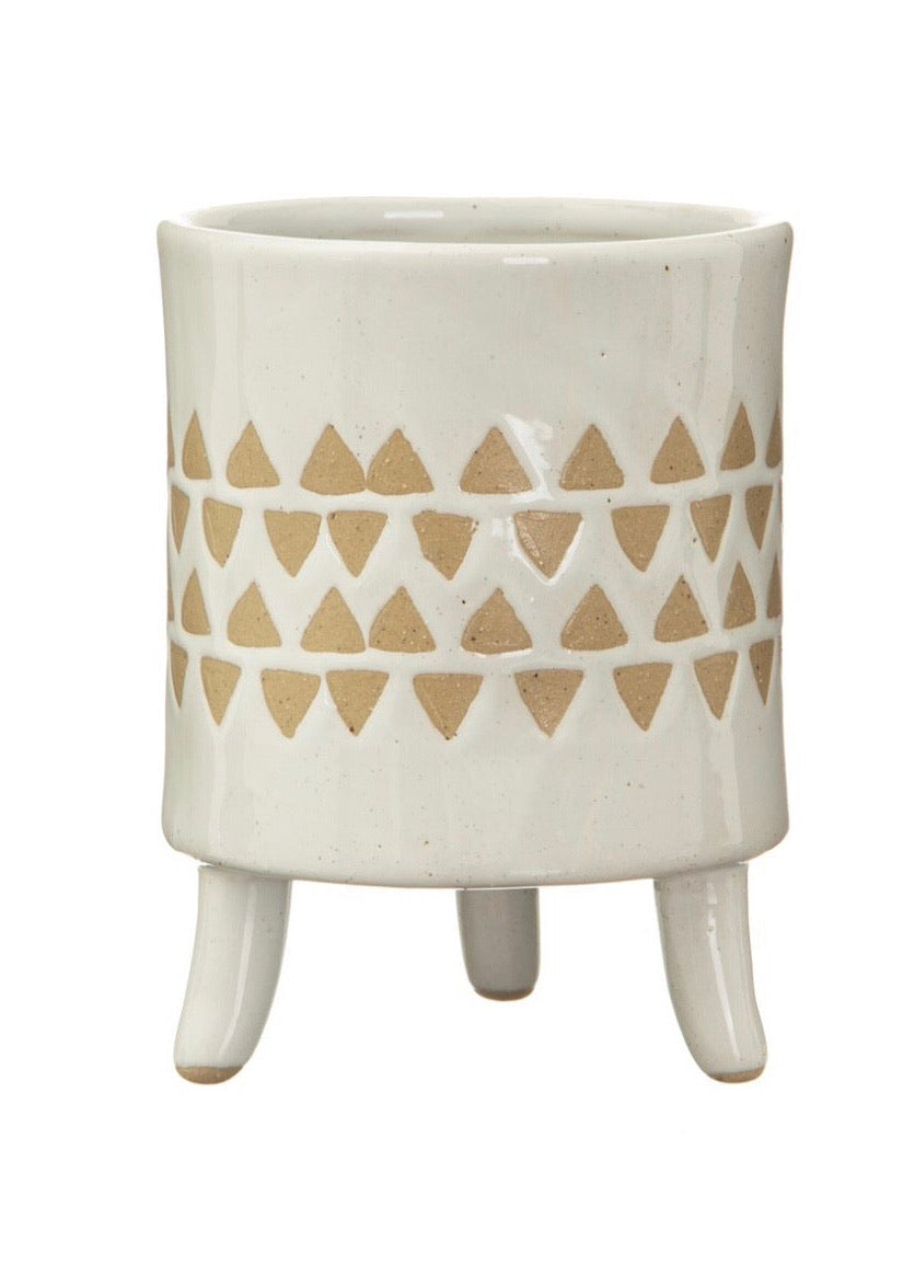 White planter with legs with brown detailing 